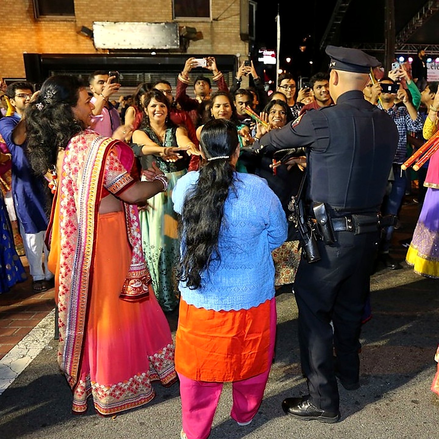 Police officer joining the garba