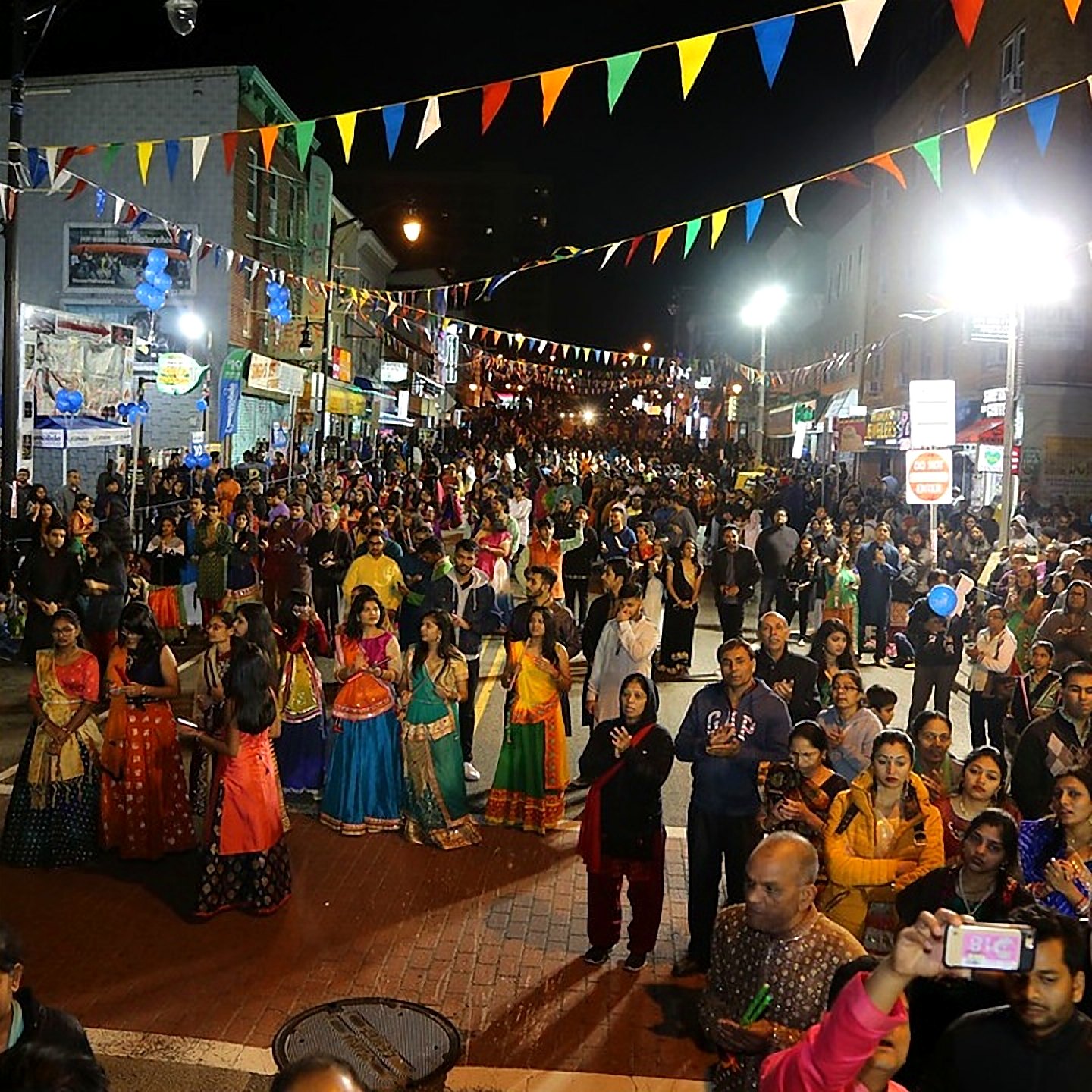 Newark Avenue decorated with flags and lights during Navratri